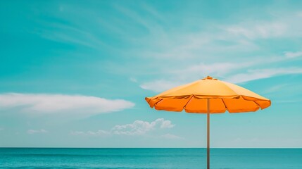 Beach umbrella in front of blue sky and sea -