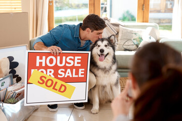 Couple, happy and kiss dog while moving into new home, investment and relocation. Real estate, bond...