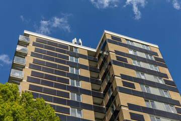 Horizontal solar panels placed horizontally on the walls of a high rise apartments building