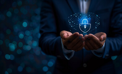 
Businessman holding a virtual digital padlock and icon of an internet security network in the style of a data protection concept on a dark blue background with copy space for text. The stock photo wa