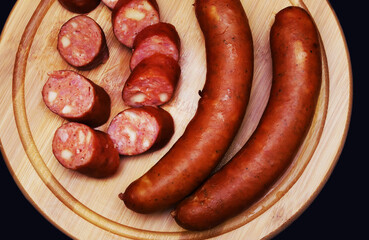 Country-style fried sausage on a cutting board. Close-up