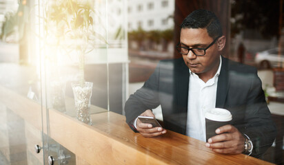 Phone, coffee and businessman in cafe reading online news with mobile app, website or internet....
