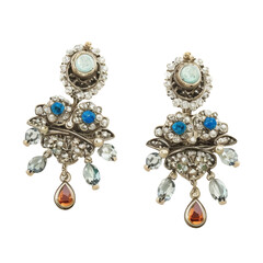 A pair of women's jewelry earrings. Vintage jewelry. Pearls, blue, red, colorless gems.