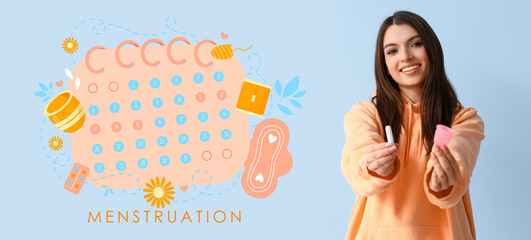 Young woman with tampon and menstrual cup on blue background