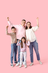 Happy little children with their parents on pink background