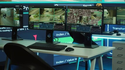 Empty agency office works on traffic surveillance with CCTV security system, public safety monitoring. Observation room with computers and a big screen deals with radar and satellite reconnaissance.