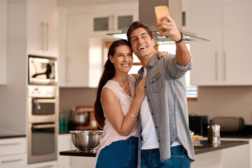 Couple, home kitchen and selfie with mobile for profile picture together, social media post and...