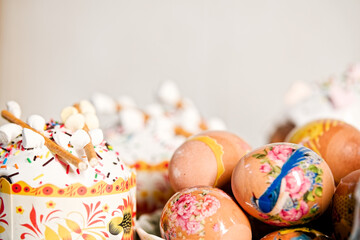 Composition of easter cakes with protein glaze, sugar sprinkles, marshmallow on top and eggs...