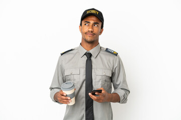 African American safeguard over isolated white background holding coffee to take away and a mobile...