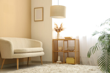 Interior of stylish living room with sofa, shelving unit and light curtains