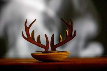 Deer horn with six points on rustic smoke background. Single Malt Scotch Whiskey