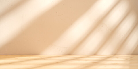 Empty table on sand color background with natural shadows on the wall. Mock up for branding...