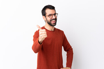 Caucasian handsome man with beard over isolated white background with thumbs up because something good has happened