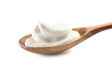 Sour cream in wooden spoon isolated on white