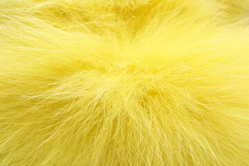Fototapeta premium Texture of yellow faux fur as background, closeup