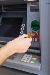 Card, hand and atm in bank for withdrawal, cash and payment or deposit in savings account. Machine, person and transaction for money, balance and transfer with insurance against theft, fraud and scam