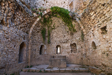 Altar of a medieval church in the ruins of the Cathar castle of Peyrepertuse in southern France - obrazy, fototapety, plakaty