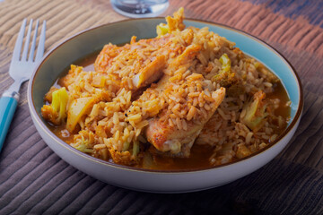 Indian styled fish and vegetable curry and rice.