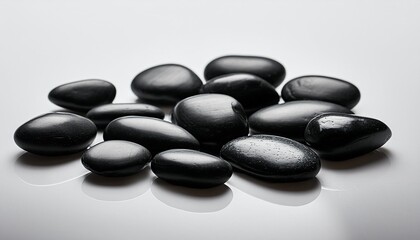 black pebbles on white background