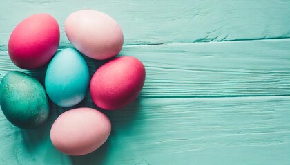 beautiful painted easter eggs on a pastel turquoise background modern easter eggs are painted with natural mint turquoise pink dye