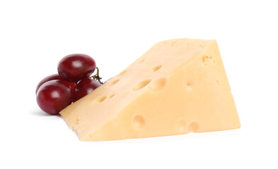 Piece of delicious cheese and grapes isolated on white