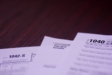 Income tax and credit for spread on an accountant's wooden table