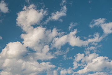 A bright blue sky full of clouds