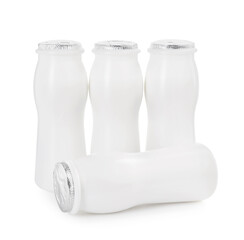 Tasty yogurt in bottles isolated on white