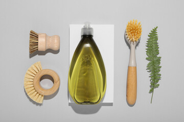 Flat lay composition with different cleaning supplies on light gray background