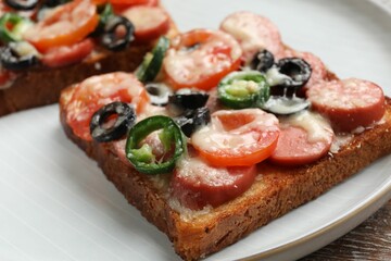 Tasty pizza toast on table, closeup view