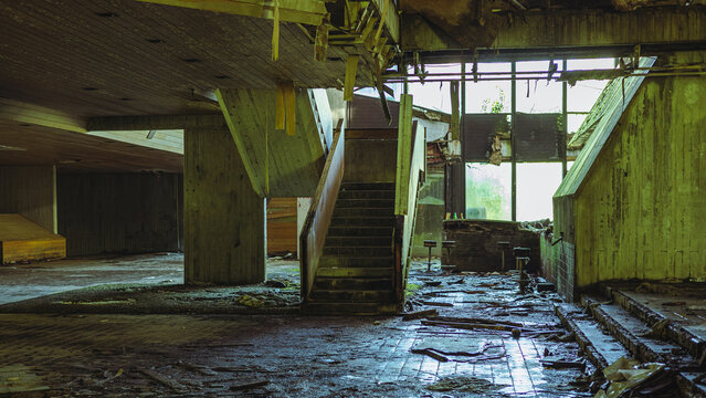Interior of now deserted political school in kumrovec, croatia. Old majestic building decaying in time, once glorious now forgotten. Ruins of an important school in former yugoslavia