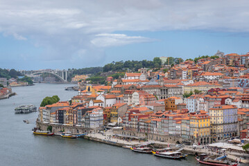 Aerial view of Porto city, Portugal with waterfront area called Ribeira and Bolsa Palace. Arrabida...