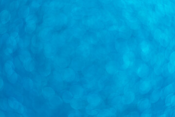 Abstract blurred background. Defocused portrait lens back. Backdrop bokeh. Vivid blue.