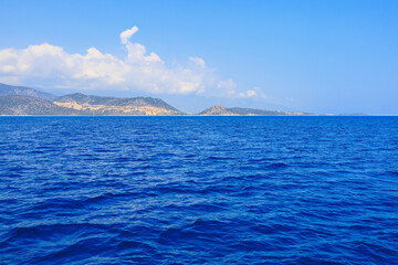 View of the rocky shore from the sea. Mediterranean Sea in Turkey. Popular tourist places....