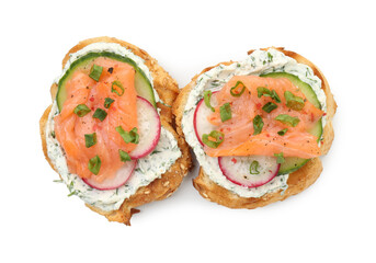Tasty canapes with salmon, cucumber, radish and cream cheese isolated on white, top view