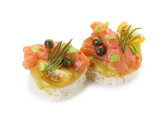 Tasty canapes with salmon, tomatoes, capers and herbs isolated on white