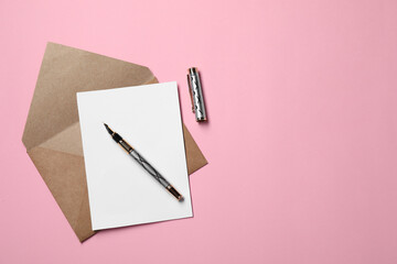Blank sheet of paper, letter envelope and pen on pink background, top view. Space for text