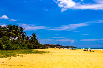 Tropical nature sand water waves fun Bentota Beach Sri Lanka.