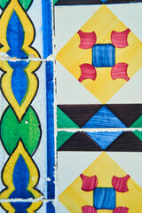 A vibrant azure and red textile Portugal pattern, showcasing creative arts through a symmetrical...