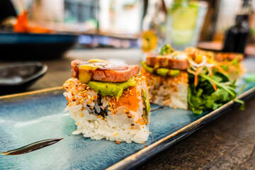 Overhead view of platter of sushi rolls