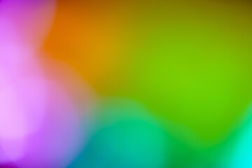 Illuminated abstract background in green pink orange and aqua multicolor defocused contemporary light blur backdrop for spring summer design element texture overlay