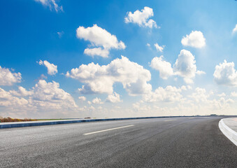 Asphalt background beneath a cloudless sky.