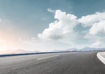 Road stretching into the clear blue sky.