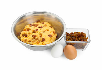 Dough with raisins in bowl and eggs isolated on white