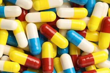 Many antibiotic pills as background, top view