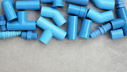 Plumber equipment with blue pvc pipe connections for plumbing work.
