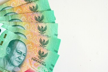 A group of twenty thousand rupiah banknotes isolated on white background with copy space area