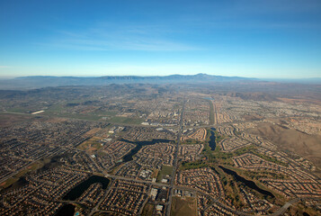 Aerial view from hot air balloon of housing tracts with lakes  in Menifee southern California...