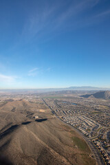 Blue sky daytime aerial view from hot air balloon of housing in Menifee southern California United States