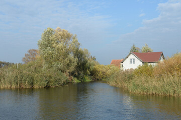 Fototapeta na wymiar House on the banks of the Nemonin River in the Kaliningrad region